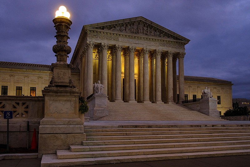 In this Oct. 5, 2018, file photo, the U. S. Supreme Court building stands quietly before dawn in Washington. The Constitution says you can't be tried twice for the same offense. And yet Terance Gamble is sitting in prison today because he was prosecuted separately by Alabama and the federal government for having a gun after an earlier robbery conviction. he Supreme Court is considering Gamble's case Thursday, Dec. 6, and the outcome could have a spillover effect on the investigation into Russian meddling in the 2016 election. (AP Photo/J. David Ake, File)