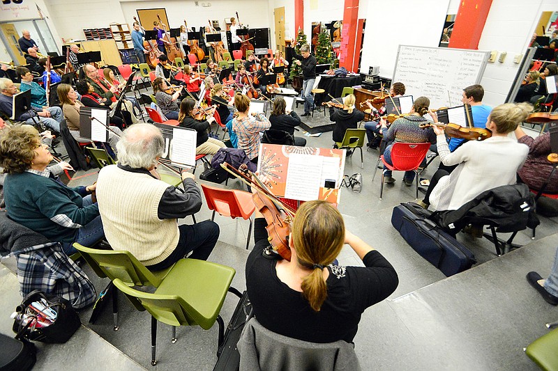 The Jefferson City Symphony Orchestra rehearse Monday at Jefferson City High School. They will be performing Handel's "Messiah" Sing-Along at 4 p.m. Sunday at Richardson Performing Arts Center.