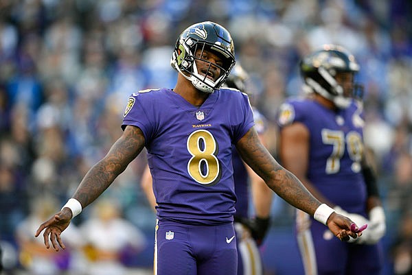In this Nov. 25 file photo, Ravens quarterback Lamar Jackson stands on the field in the second half of a game against the Raiders in Baltimore. Since taking over as the starting quarterback, Jackson has revitalized the Ravens running attack and kept opposing offenses off the field by dominating time of possession. He will need do that again this week to help slow down the high-flying Chiefs, who lead the NFL with 37 points per game.