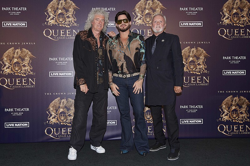 In this Aug. 28, 2018, file photo, Brian May, from left, Adam Lambert, and Roger Taylor of Queen + Adam Lambert pose for a photo at the "The Crown Jewels" residency press conference at the MGM Resorts aviation hanger in Las Vegas. Queen and Adam Lambert are launching a six-week North America tour following the release of the Freddie Mercury biopic "Bohemian Rhapsody." Live Nation announced Monday, Dec. 3, the 23-date tour, featuring original band members May and Taylor, will kick off in Vancouver, British Columbia, on July 10. (Photo by Al Powers/Powers Imagery/Invision/AP, File)