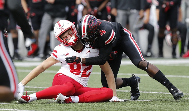 In this Nov. 3, 2018, file photo, Ohio State defensive back Jordan Fuller tackles Nebraska tight end Kurt Rafdal during the first half of an NCAA college football game Saturday, in Columbus, Ohio. Fuller was ejected from the game for a targeting penalty on the play. The NCAA says the number of enforced targeting penalties in the Football Bowl Subdivision this regular season was the same as in 2017. (AP Photo/Jay LaPrete, File)