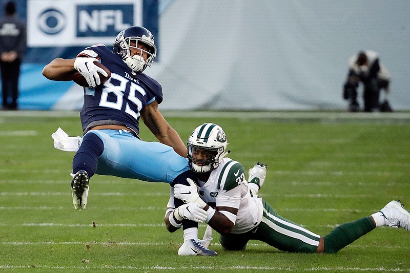 Tennessee Titans tight end MyCole Pruitt (85) is brought down by New York Jets strong safety Jamal Adams, right, in the first half of an NFL football game Sunday, Dec. 2, 2018, in Nashville, Tenn. (AP Photo/James Kenney)