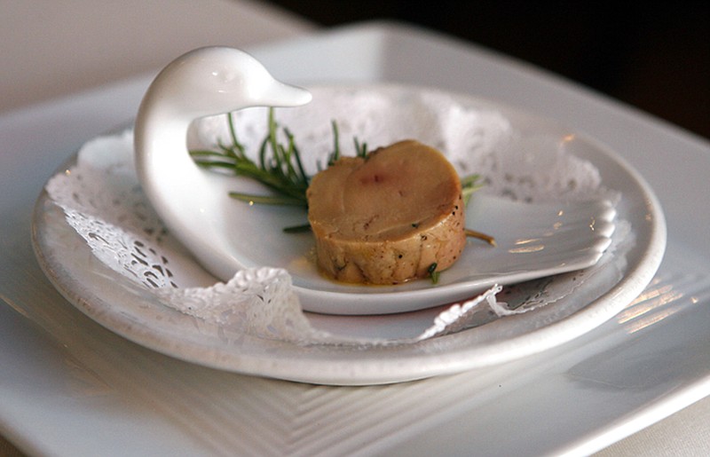 FILE - In this Aug. 9, 2006, file photo, a serving of salt-cured fresh foie gras with herbs is displayed at Chef Didier Durand's Cyrano's Bistrot and Wine Bar in Chicago. California prosecutors said, Friday, Dec. 7, 2018, that Amazon has agreed not to sell foie gras in the state from birds that have been force fed after state lawmakers banned that form of the fatty duck and goose liver delicacy. (AP Photo/M. Spencer Green, File)