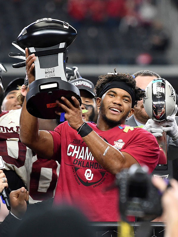 Oklahoma quarterback Kyler Murray hoists the Most Outstanding Player trophy after beating Texas in the Big 12 championship game last Saturday in Arlington, Texas. Murray was named the Associated Press Player of the Year on Thursday.