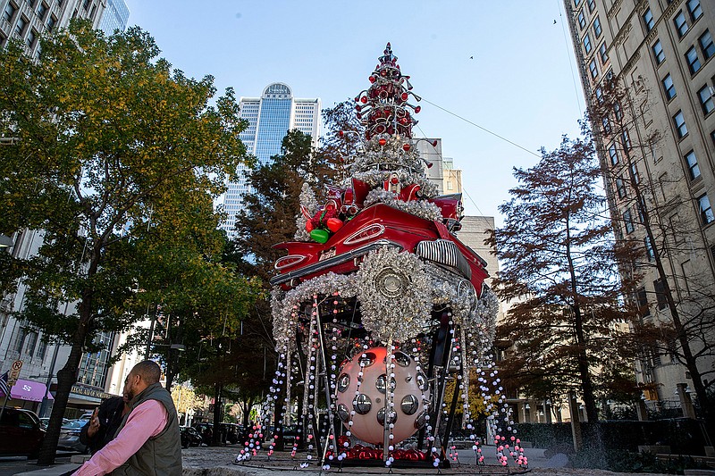 The car Christmas three at Pegasus Plaza in Dallas on Thursday, November 29, 2018. The tree was originally commissioned by Neiman Marcus in the early 2000s. It was used in a window display for a year and placed into storage. The tree was donated by Neiman to Downtown Dallas Inc. in 2012 and has been displayed at the plaza since. (Shaban Athuman/Dallas Morning News/TNS)