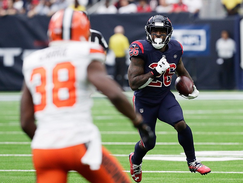 Houston Texans running back Lamar Miller (26) runs against the Cleveland Browns during the first half of an NFL football game, Sunday, Dec. 2, 2018, in Houston. (AP Photo/Sam Craft)