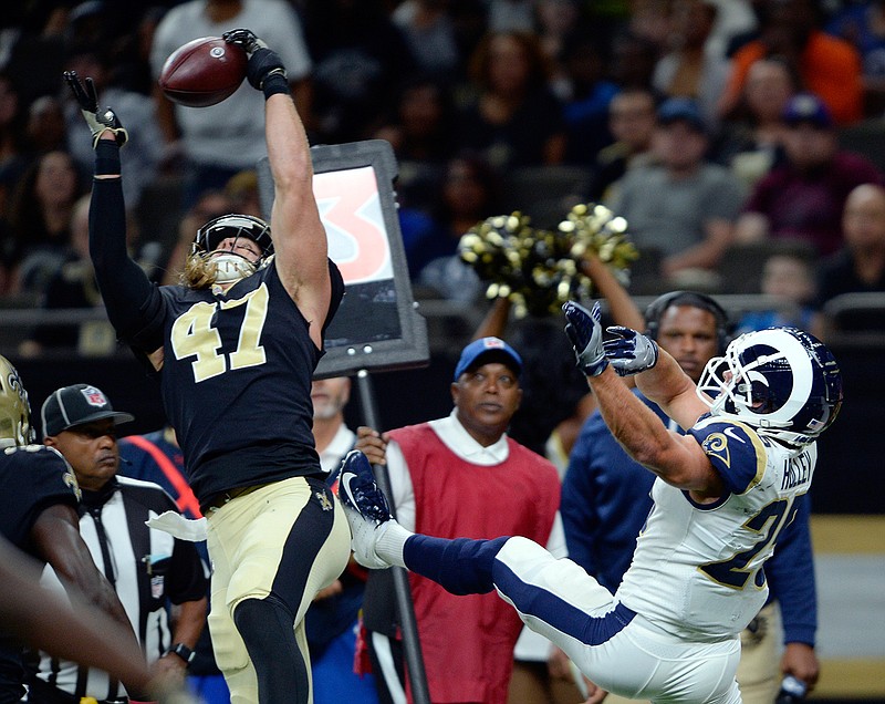 In this Aug. 30, 2018, file photo, New Orleans Saints linebacker Alex Anzalone (47) intercepts a pass intended for Los Angeles Rams running back Nick Holley (25) in the first half of an NFL preseason football game in New Orleans. No matter how much New Orleans' defense may have improved since this season's opening week, Anzalone does not see the benefit in dismissing as irrelevant the 48 points the Saints surrendered in a Week 1 loss to the Buccaneers. (AP Photo/Bill Feig, File)