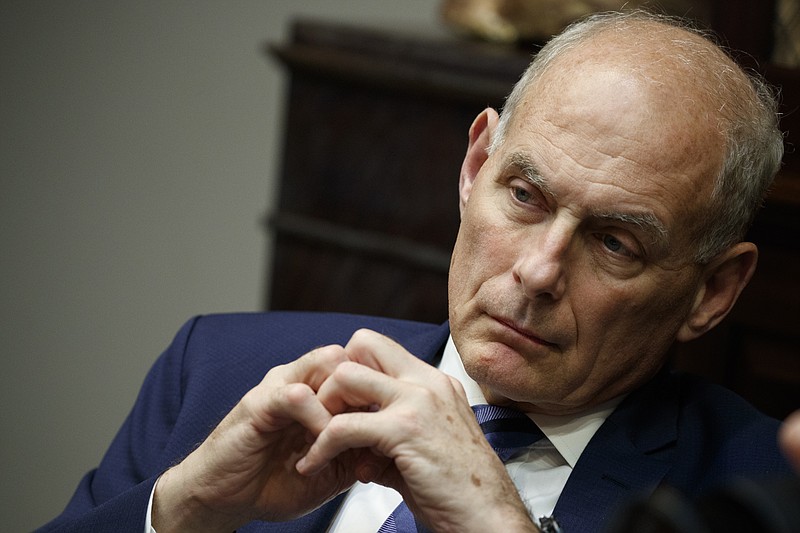 In this June 21, 2018 photo, White House chief of staff John Kelly listens as President Donald Trump speaks during a lunch with governors in the Roosevelt Room of the White House in Washington. Trump says chief of staff John Kelly will leave his job at the end of the year.(AP Photo/Evan Vucci)