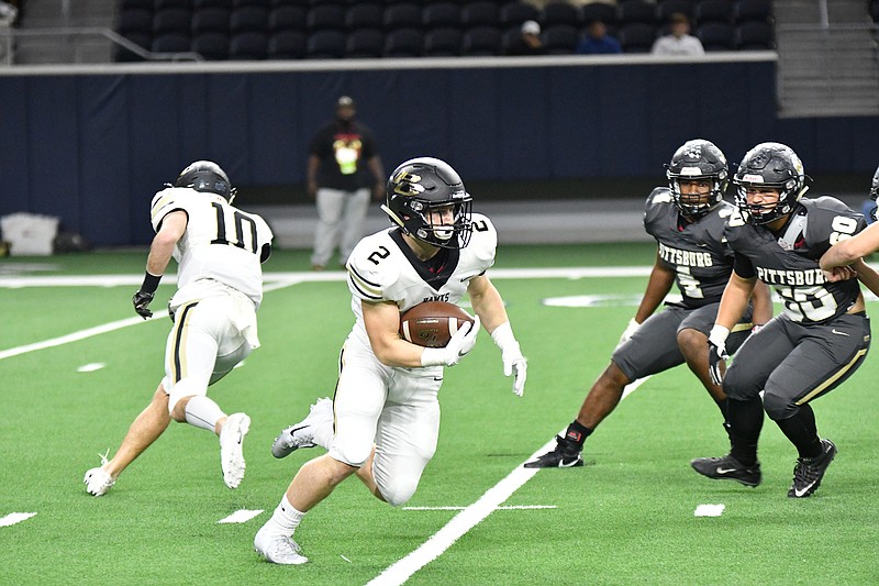 Pleasant Grove running back Bruce Garrett runs with the ball Friday night against Pittsburg in Frisco, Texas. Bruce Garrett raced 49 yards for the finishing score, and the Hawks reached the Class 4A, Division II state semifinals and claimed the Region II-4A, Division II title. (Photo by Kevin Sutton)

