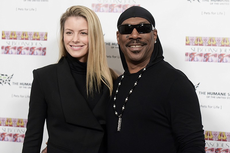 In this Nov. 20, 2016, file photo, Paige Butcher, left, and Eddie Murphy attend "SUBCONSCIOUS" by Bria Murphy Gallery Opening at Lace Gallery in Los Angeles. Murphy and his fiancee Butcher have a new baby boy. The couple released a statement through Murphy's publicist Monday, Dec. 3, 2018, saying Max Charles Murphy was born Friday, Nov. 30 and weighed 6 pounds, 11 ounces. (Photo by Richard Shotwell/Invision/AP, File)