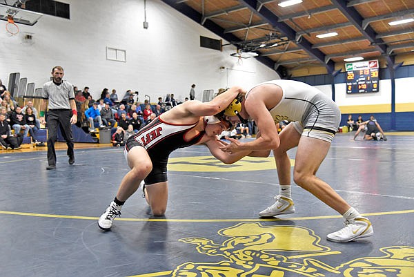 Jefferson City's Will Kuster tries to gain leverage on Lebanon's Trevor Christian during Friday's competition in the Missouri Duals at Helias Gym.