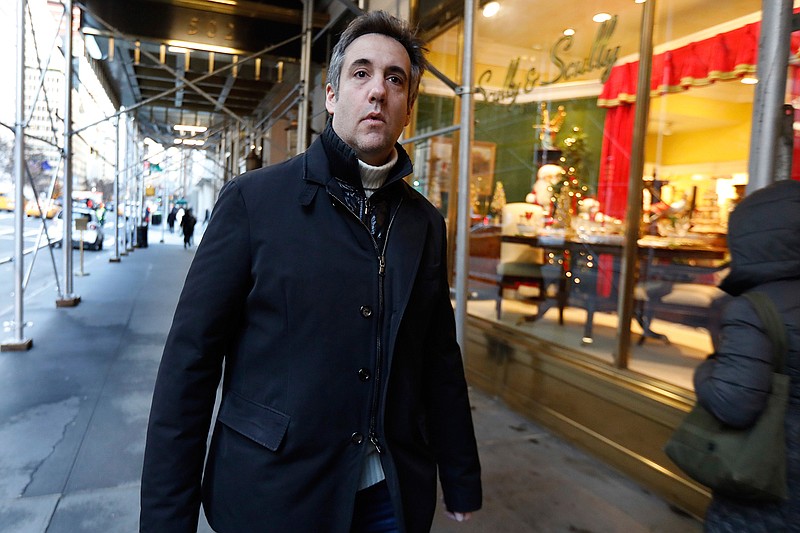 Michael Cohen, former lawyer to President Donald Trump, leaves his apartment building on New York's Park Avenue, Friday, Dec. 7, 2018. In the latest filings Friday, prosecutors will weigh in on whether Cohen deserves prison time and, if so, how much. (AP Photo/Richard Drew)