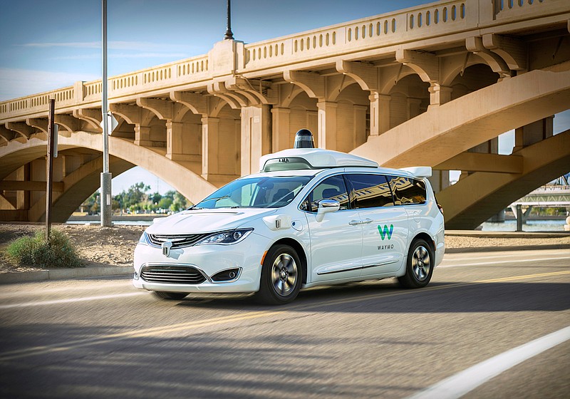 This undated photo provided by Waymo shows its self-driving minivan. Google's self-driving car spinoff is finally ready to try to profit from its nearly decade-old technology. Waymo introduced a small-scale ride-hailing service in the Phoenix area Wednesday, Dec. 4, 2018, that will include a human behind the wheel in case the robotic vehicles malfunction. (Waymo via AP)