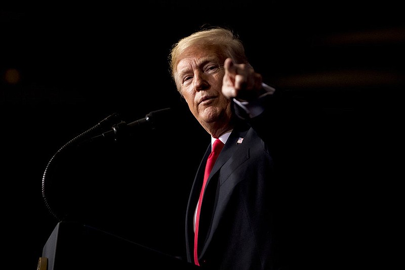 President Donald Trump points at a member of the audience while speaking the 2018 Project Safe Neighborhoods National Conference at the Westin Kansas City at Crown Center in Kansas City, Mo., Friday, Dec. 7, 2018.