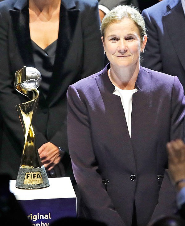 United States coach Jill Ellis stands next to the World Cup trophy Saturday during the women's soccer World Cup France 2019 draw in Boulogne-Billancourt, outside Paris.