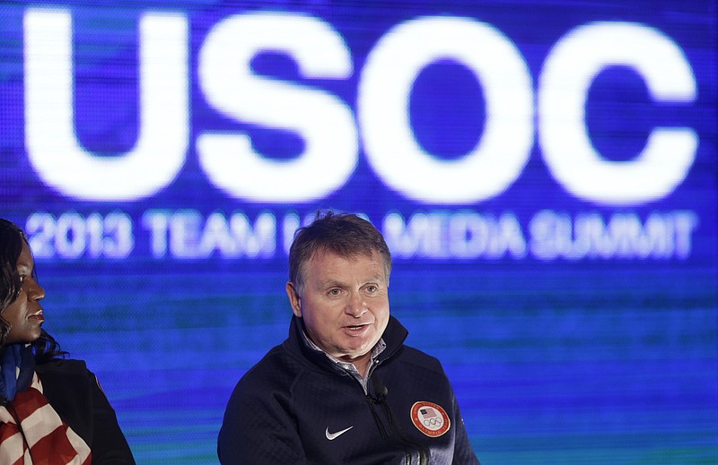 FILE - In this Oct. 1, 2013, file photo, Alan Ashley, chief of sport performance with the U.S. Olympic Committee, speaks with reporters during a news conference in Park City, Utah. The U.S. Olympic Committee has fired chief of sport performance Alan Ashley in the wake of an independent report that said neither he nor former CEO Scott Blackmun elevated concerns about the Larry Nassar sexual abuse allegations when they were first reported to them. The 233-page independent report was released Monday, Dec. 10, 2018. It detailed an overall lack of response when the USOC leaders first heard about the Nassar allegations from the then-president of USA Gymnastics, Steve Penny. Blackmun resigned in February because of health concerns.(AP Photo/Rick Bowmer, File)