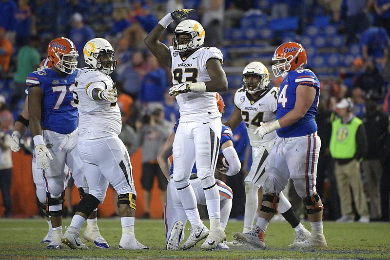 Missouri defensive lineman Tre Williams (93) celebrates after sacking Florida quarterback Kyle Trask during the second half of an NCAA college football game Saturday, Nov. 3, 2018, in Gainesville, Fla. Missouri won 38-17. (AP Photo/Phelan M. Ebenhack)