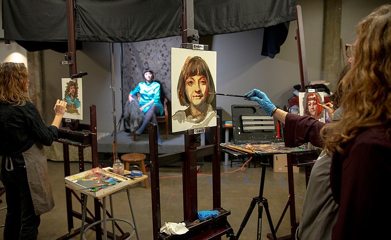 Karen Offutt, left, and Karen Maness paint portraits of model Kelli Bland on Nov. 9 at Atelier Dojo's studio in Austin, where artists and their allies have found increasingly creative ways to land affordable art spaces.