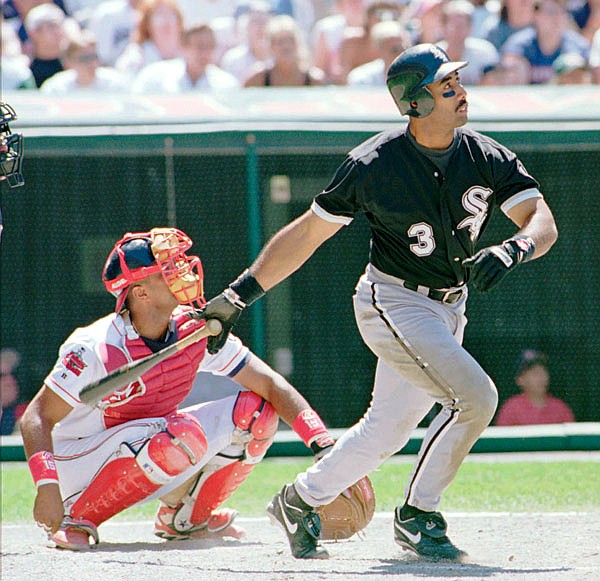 In this, July 6, 1996, file photo, Harold Baines of the White Sox watches his ninth inning solo home run head for the center field seats during the White Sox's 3-2 win against the Indians in Cleveland.