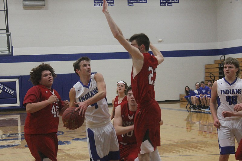 <p>Democrat photo/ Kevin Labotka</p><p>Russellville’s Jared Shirley tries to get to the hoop against Prairie Home’s Clayton Pethan during Prairie Home’s 59-39 win Dec. 10 over Russellville.</p>