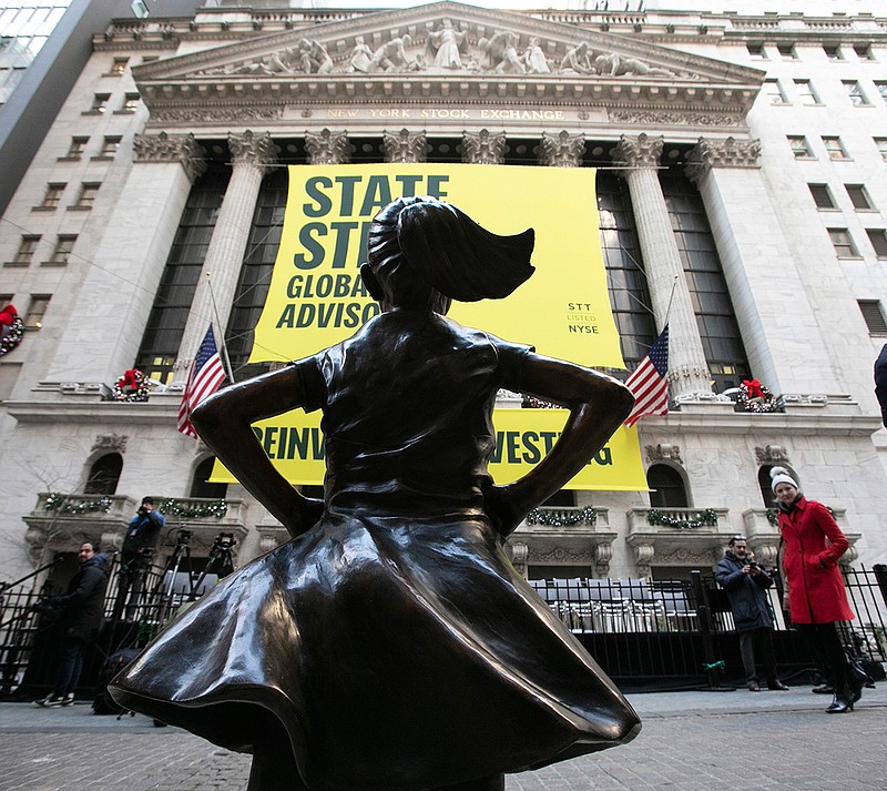 The Fearless Girl statue is unveiled Monday at its new location in front of the New York Stock Exchange. The statue, considered by many to symbolize female empowerment, was previously located near the Charging Bull statue on lower Broadway.