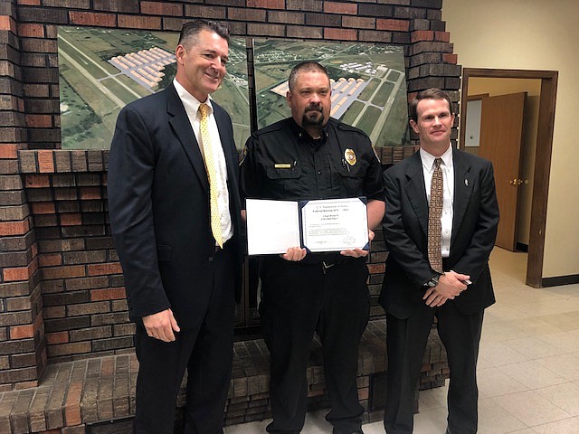 <p>News Tribune photo/ Danisha Hogue</p><p>FBI special agent Curtis Bryant poses with Eldon Police Chief Brian Kidwell and senior supervisory agent Chad John. Kidwell was presented with a certificate signed by FBI Director Christopher Wray at the Eldon Board of Alderman meeting Tuesday.</p>