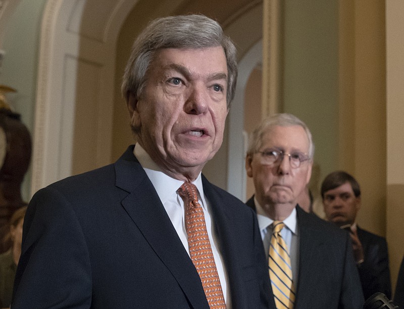 FILE - In this Aug. 21, 2018, file photo, Sen. Roy Blunt, R-Mo., speaks as Senate Majority Leader Mitch McConnell, R-Ky., listens at the Capitol in Washington. House and Senate negotiators have reached an agreement on a bill to overhaul the process for handling sexual misconduct allegations on Capitol Hill. The push for the legislation took on new urgency in the past year, as more than a half-dozen lawmakers resigned amid allegations of sexual misconduct. (AP Photo/J. Scott Applewhite, File)