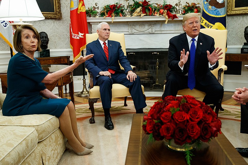 Vice President Mike Pence, center, looks on as House Minority Leader Rep. Nancy Pelosi, D-Calif., argues with President Donald Trump during a meeting in the Oval Office of the White House, Tuesday, Dec. 11, 2018, in Washington. (AP Photo/Evan Vucci)