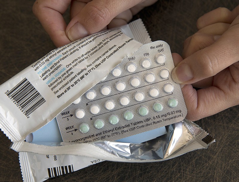 FILE - In this Aug. 26, 2016, file photo, a one-month dosage of hormonal birth control pills is displayed in Sacramento, Calif. (AP Photo/Rich Pedroncelli, File)