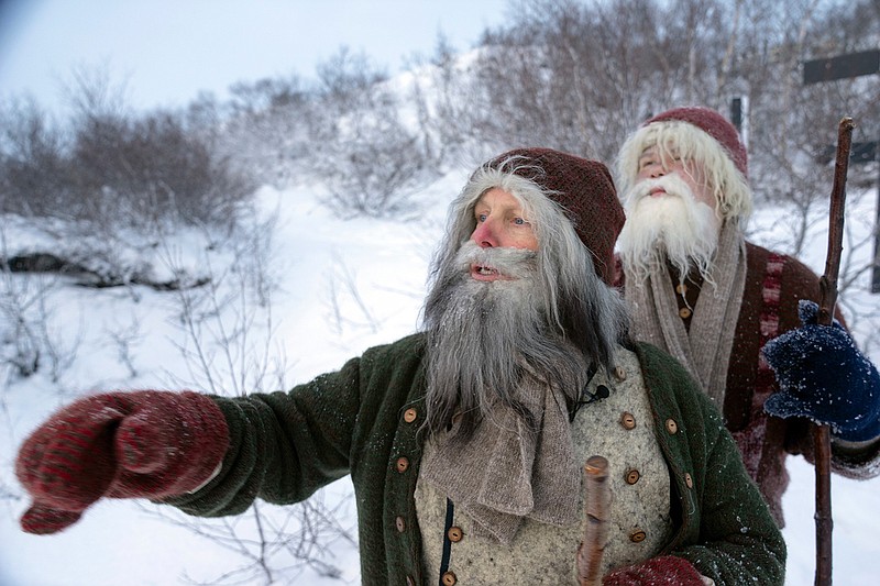 Local actors at the Dimmuborgir lava field in northern Iceland on Saturday Dec. 8, 2018, pose as the Icelandic Yule Lads, a band of mischievous troll brothers that have taken the role of Father Christmas. Instead of a friendly Santa Claus, children in Iceland enjoy favors from 13 mischievous troll brothers that arrive from the mountains thirteen days before Christmas. (AP Photo/Egill Bjarnason)