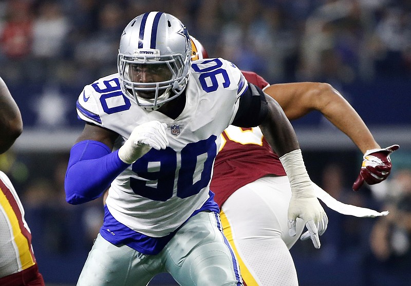 In this Thursday, Nov. 22, 2018, file photo, Dallas Cowboys defensive end Demarcus Lawrence (90) during the first half of an NFL football game against the Washington Redskins in Arlington, Texas. Dallas defensive coordinator Rod Marinelli remembers the night the Cowboys traded up in the second round of the 2014 draft to grab DeMarcus Lawrence because they thought he was the last pass rusher on the board with the skills to become elite. Four years and several significant draft decisions later, Dallas is in line for its highest defensive ranking since 2003. (AP Photo/Ron Jenkins, File)
