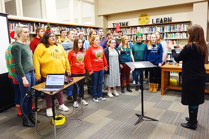 Members of the Fulton High School Chamber Choir sing a parting blessing before the Wednesday Board of Education meeting. The performance set a festive mood for the evening.