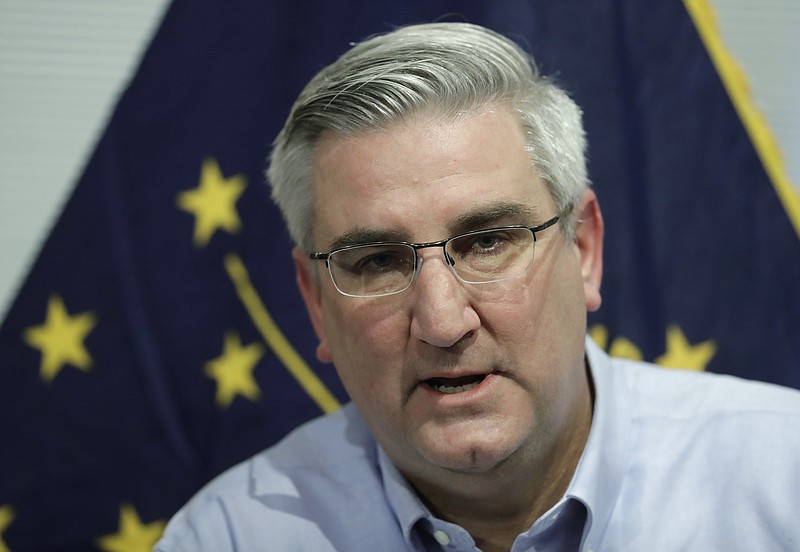 FILE - In this Dec. 6, 2018 file photo Indiana Gov. Eric Holcomb speaks about his agenda priorities for the upcoming legislative session, in Zionsville, Ind. (AP Photo/Darron Cummings File)