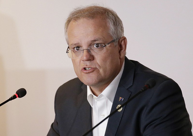 FILE - In this Nov. 18, 2018, file photo, Australian Prime Minister Scott Morrison speaks during the APEC 2018 meetings in Port Moresby, Papua New Guinea. Australia has decided to formally recognize west Jerusalem as Israel’s capital, but won’t move its embassy until there’s a peace settlement between Israel and Palestinians, Prime Minister Morrison announced Saturday. (AP Photo/Aaron Favila, File)