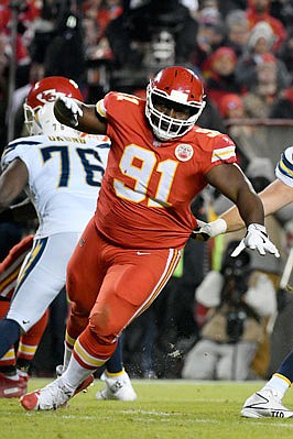 Chiefs nose tackle Derrick Nnadi rushes Chargers quarterback Philip Rivers during Thursday night's game at Arrowhead Stadium.