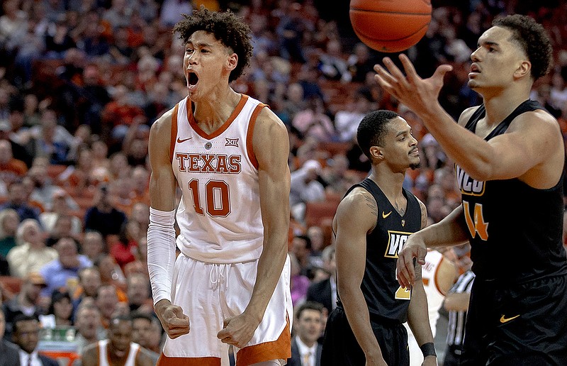 In this Wednesday, Dec. 5, 2018 file photo, Texas forward Jaxson Hayes (10) celebrates a dunk during an NCAA college basketball game against Virginia Commonwealth in Austin, Texas. Texas freshman Hayes is a meteoric rise from raw talent to early buzz as a potential 2019 NBA draft pick. (Nick Wagner/Austin American-Statesman via AP, File)