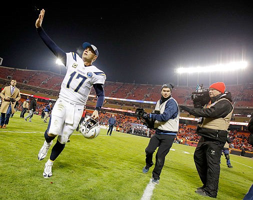 Chargers quarterback Philip Rivers waves as he runs off the field after Thursday night's 29-28 win against the Chiefs at Arrowhead Stadium.