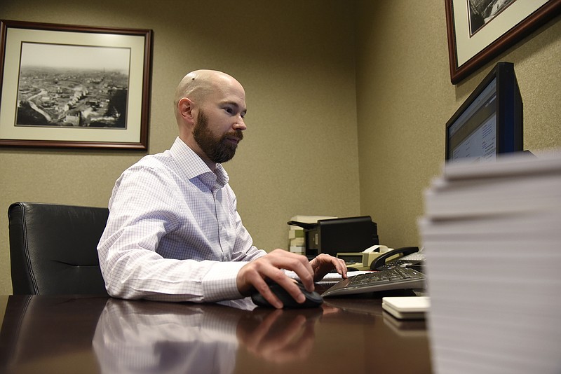 Jenna Kieser/News Tribune
Certified Public Accountant Jeremy Morris works on Thursday at Williams Keepers LLC.