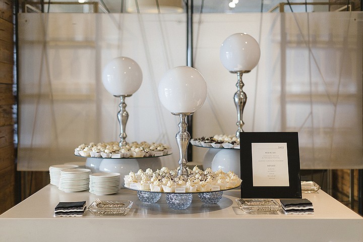 This 2018 photo shows desserts on display at Lauren Aust and Sonny Yuen's wedding in Kansas City, Mo. The couple referenced personal and shared experiences with their food offerings. There were donut holes from famed Kansas City donut shop Lamar's, and an array of sweet bites. (Sara Reed Studios via AP)