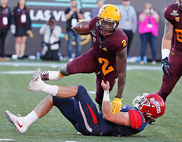 Fresno State linebacker George Helmuth (34) tackles Arizona State wide receiver Brandon Aiyuk (2) during the second half of Saturday's Las Vegas Bowl in Las Vegas.