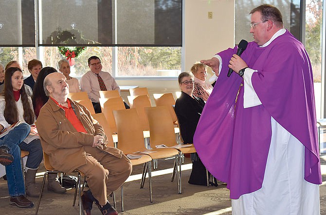 The Rev. Gregory Meystrik presides over the annual St. Mary's Hospital Tree of Love celebration Mass on Sunday at the hospital.
