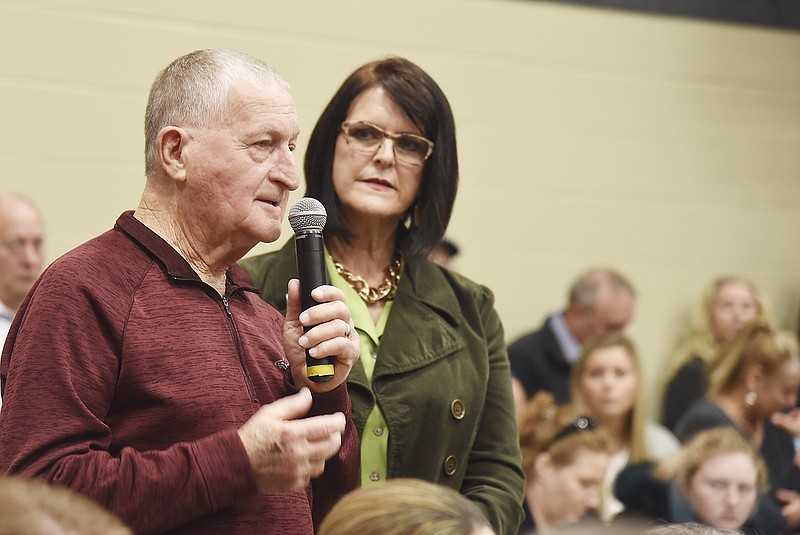 Retired area contractor Ken Otke of the Coalition for Choice group asks a question during the Dec. 10 forum regarding the possible merger of St. Mary's Hospital with the University of Missouri Health System. He was one of about 300 people in attendance.