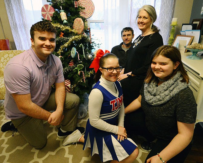 Tammy and Jerry Rodgers are pictured with their children: Josh, 18, Isabella, 14, and Elisabeth, 16, at the Central Missouri Foster Care and Adoption Association.