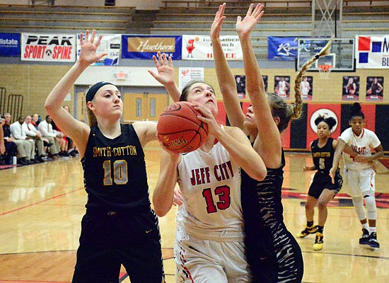 Sarah Linthacum of Jefferson City gets ready to put up a shot during Wednesday night's game against Sedalia Smith-Cotton at Fleming Fieldhouse.