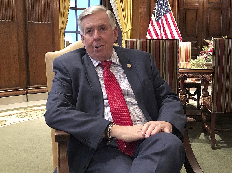 In this Dec. 18, 2018 photo, Missouri Gov. Mike Parson speaks to The Associated Press during an interview in his Capitol office in Jefferson City, Mo. Parson told The Associated Press that he opposed the "Clean Missouri" initiative approved by voters in the November elections. He specifically wants to repeal a section requiring state House and Senate districts to be drawn by a demographer to achieve "partisan fairness" and "competitiveness" based on past statewide elections. (AP Photo/David A. Lieb)