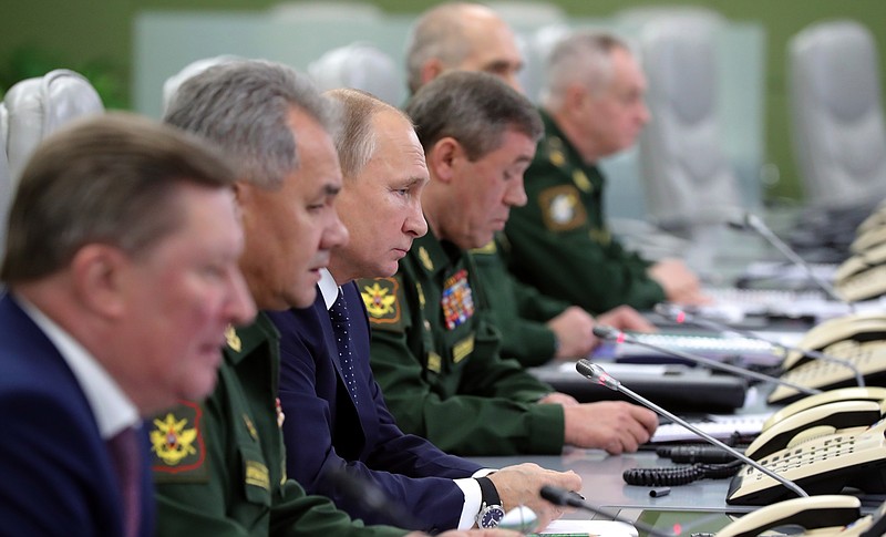 From the left, Sergei Ivanov, Russian special representative on questions of ecology and transport, Russian Defense Minister Sergei Shoigu, Russian President Vladimir Putin, and Chief of General Staff of Russia Valery Gerasimov, oversee the test launch of the Avangard hypersonic glide vehicle from the Defense Ministry's control room in Moscow, Russia, Wednesday, Dec. 26, 2018. In the test, the Avangard was launched from the Dombarovskiy missile base in the southern Ural Mountains. The Kremlin says it successfully hit a designated practice target on the Kura shooting range on Kamchatka, 6,000 kilometers (3,700 miles) away. (Mikhail Klimentyev, Sputnik, Kremlin Pool Photo via AP)