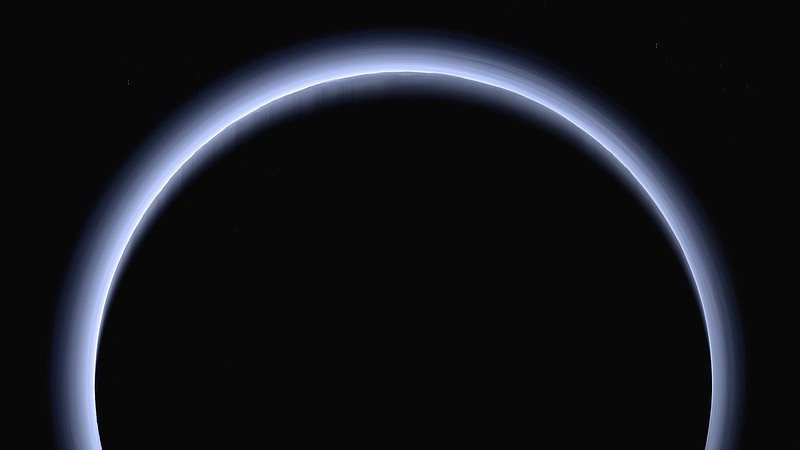 FILE - This image made available by NASA in March 2017 shows Pluto illuminated from behind by the sun as the New Horizons spacecraft travels away from it at a distance of about 120,000 miles (200,000 kilometers). The probe will ring in 2019 by exploring an even more distant and mysterious world. (NASA/Johns Hopkins University Applied Physics Laboratory/Southwest Research Institute via AP)