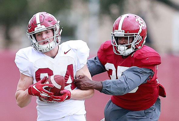 Alabama tight end Hale Hentges catches a ball against defensive back D.J. Lewis during practice Wednesday in Miami Shores, Fla. Hentges (Helias High School) and Alabama play Oklahoma on Saturday night in the Orange Bowl.
