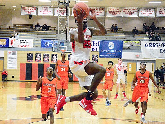 Michael Appiah-Brefo of the Jays goes up for a layup during Thursday night's game against Hopkinsville, Ky., in the opening round of the Joe Machens Great 8 Classic at Fleming Fieldhouse.