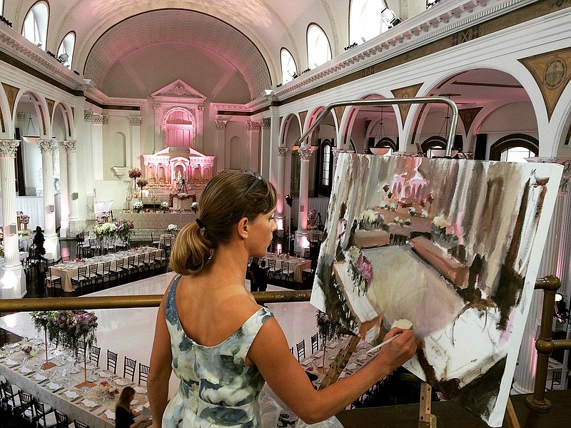 This 2016 photo shows artist Laura Swytak working on a painting during the wedding reception at the Vibiana in Downtown Los Angeles, Calif. Some couples are inviting painters to capture a scene or the mood of their big day in a work they can cherish. Having the artist at the reception also adds a special kind of entertainment. (Laura Swytak via AP)